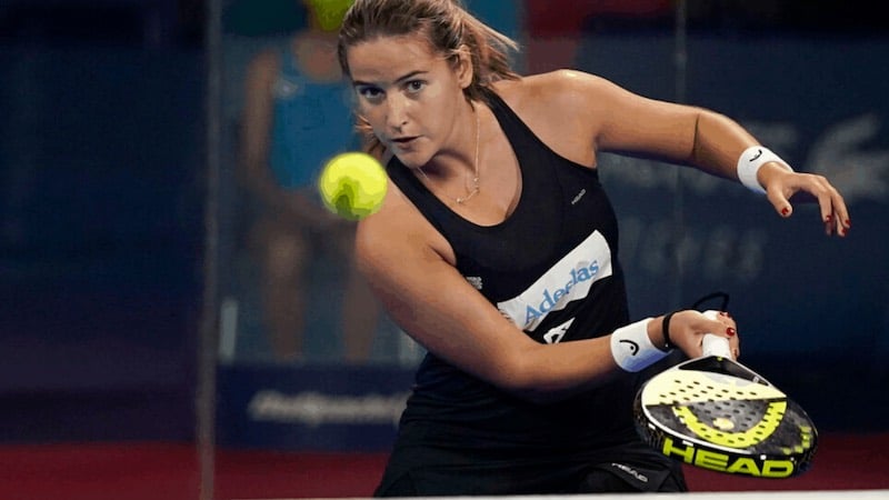 Woman performing the drop shot in Padel. Image source: WorldPadelInsider