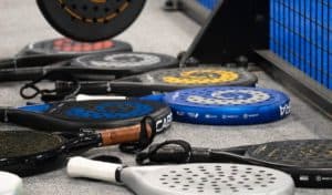 Different Padel Rackets next to Padel Court