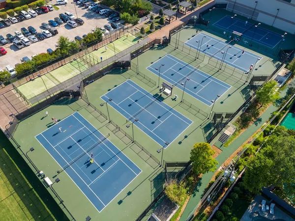 Overview of outdoor Tennis and Padel Courts at The Houstonian Hotel in Texas.
