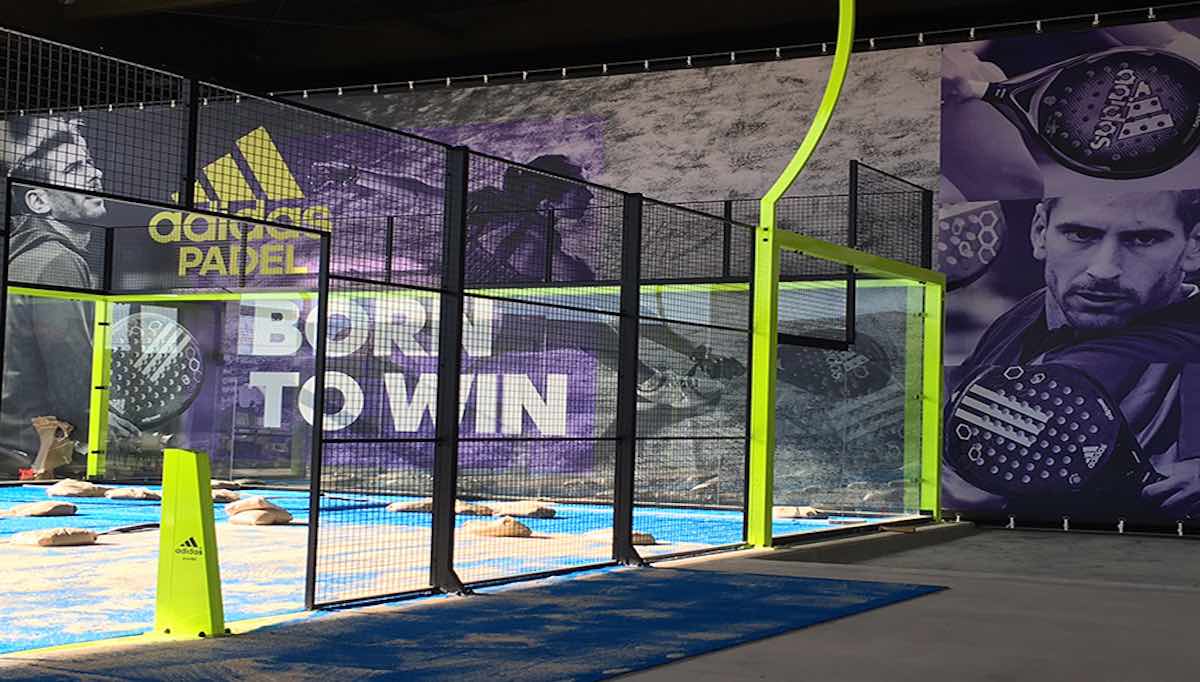 Adidas Padel - Born to win. Padel court featuring Alex Ruiz backdrop. The new Adipower Multiweight is truly impressive.